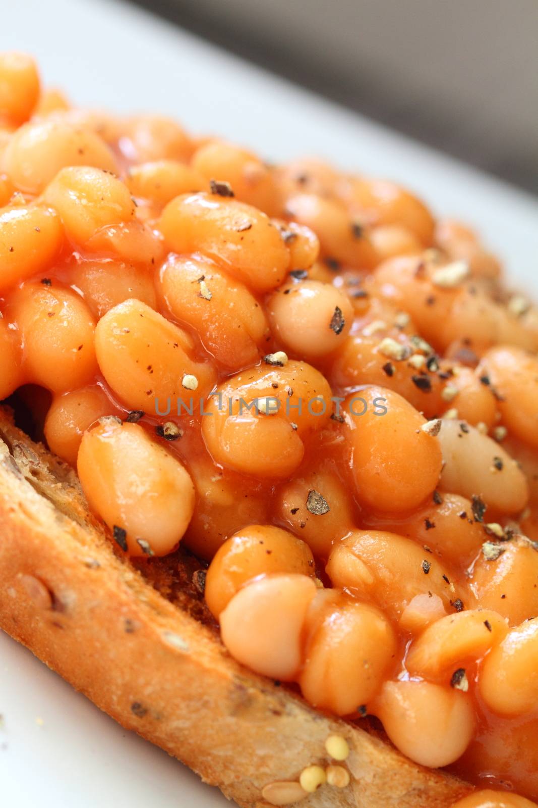 baked beans on toast with ground black pepper by mitzy