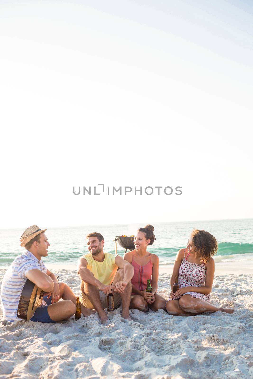 Group of friends having fun at the beach