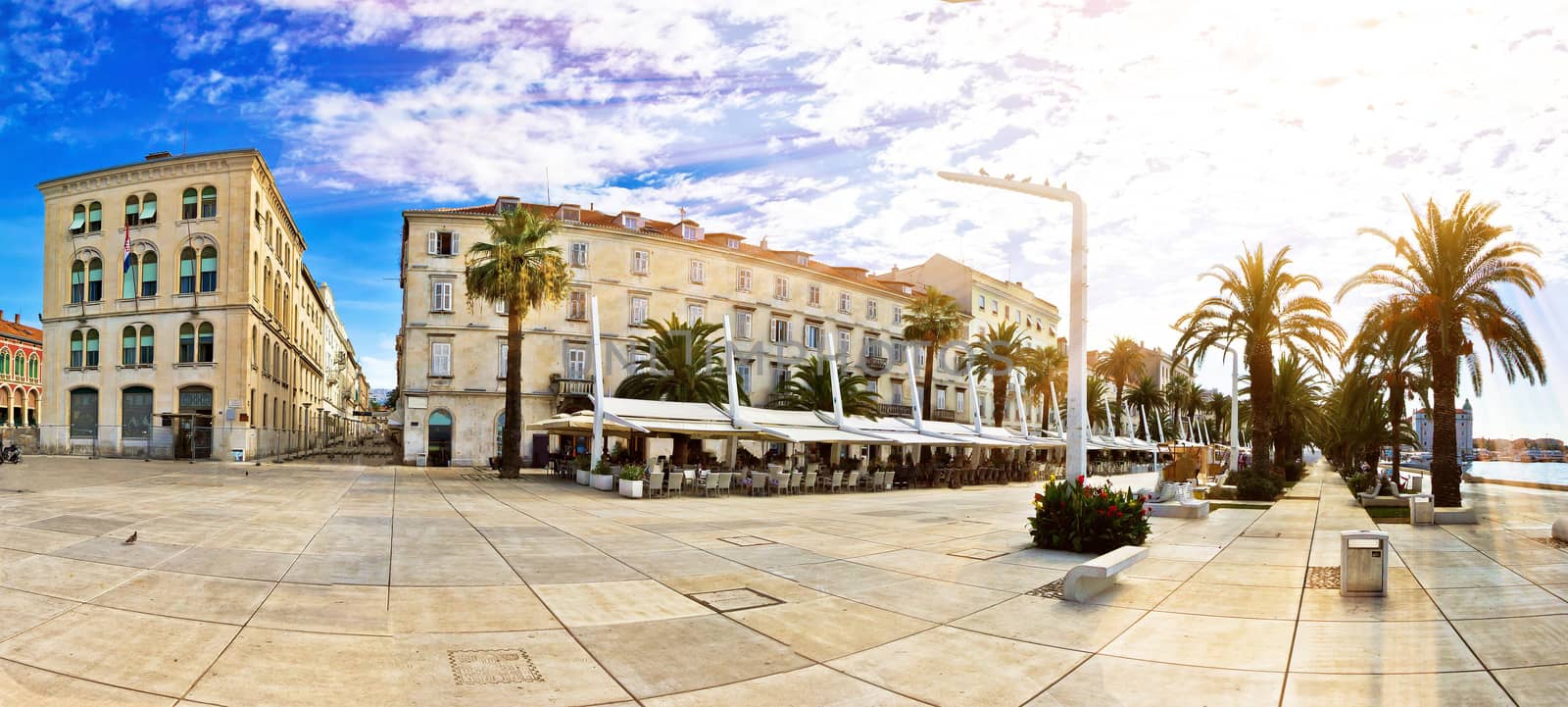 Split waterfront walkway on golden sun rays, Dalmatia, Croatia - panoramic view