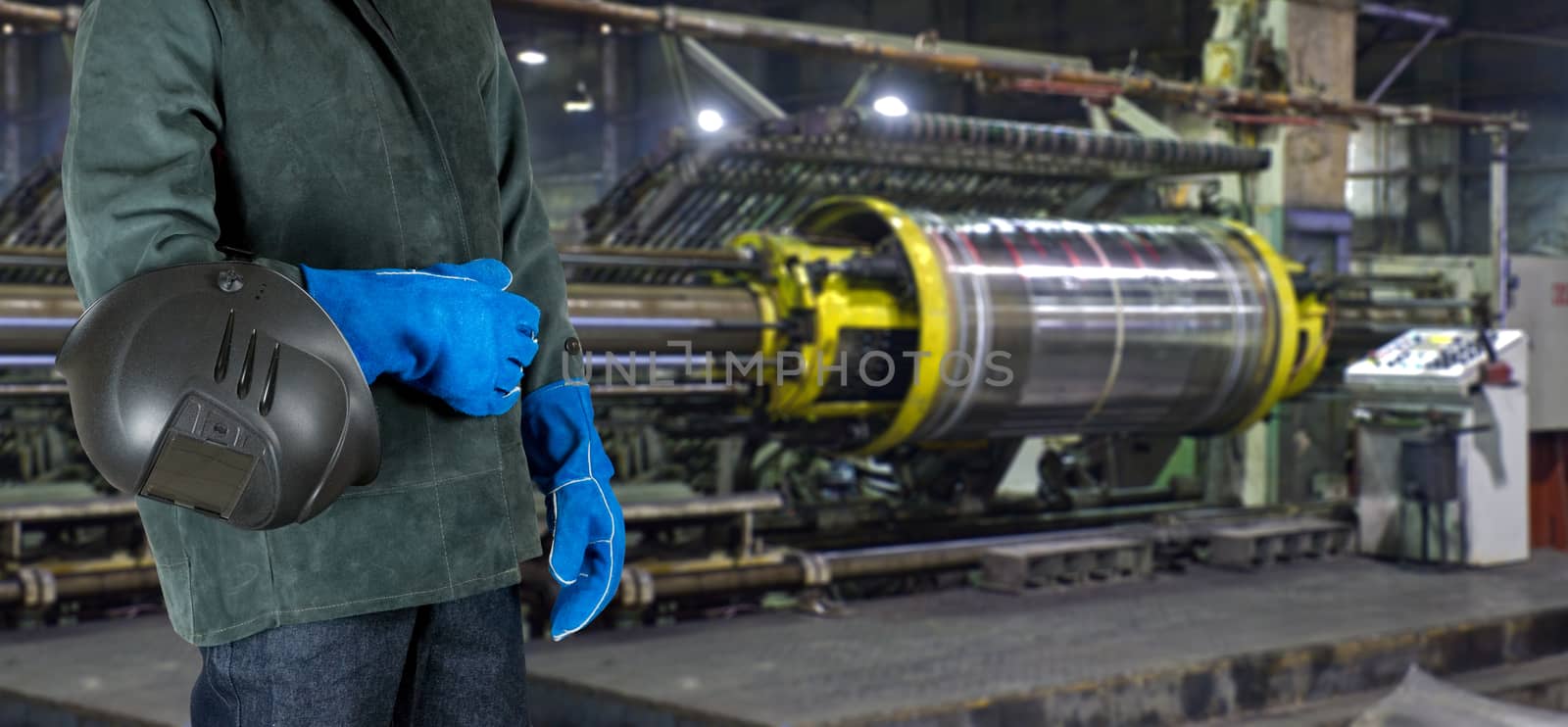 Worker with instruments at industrial factory