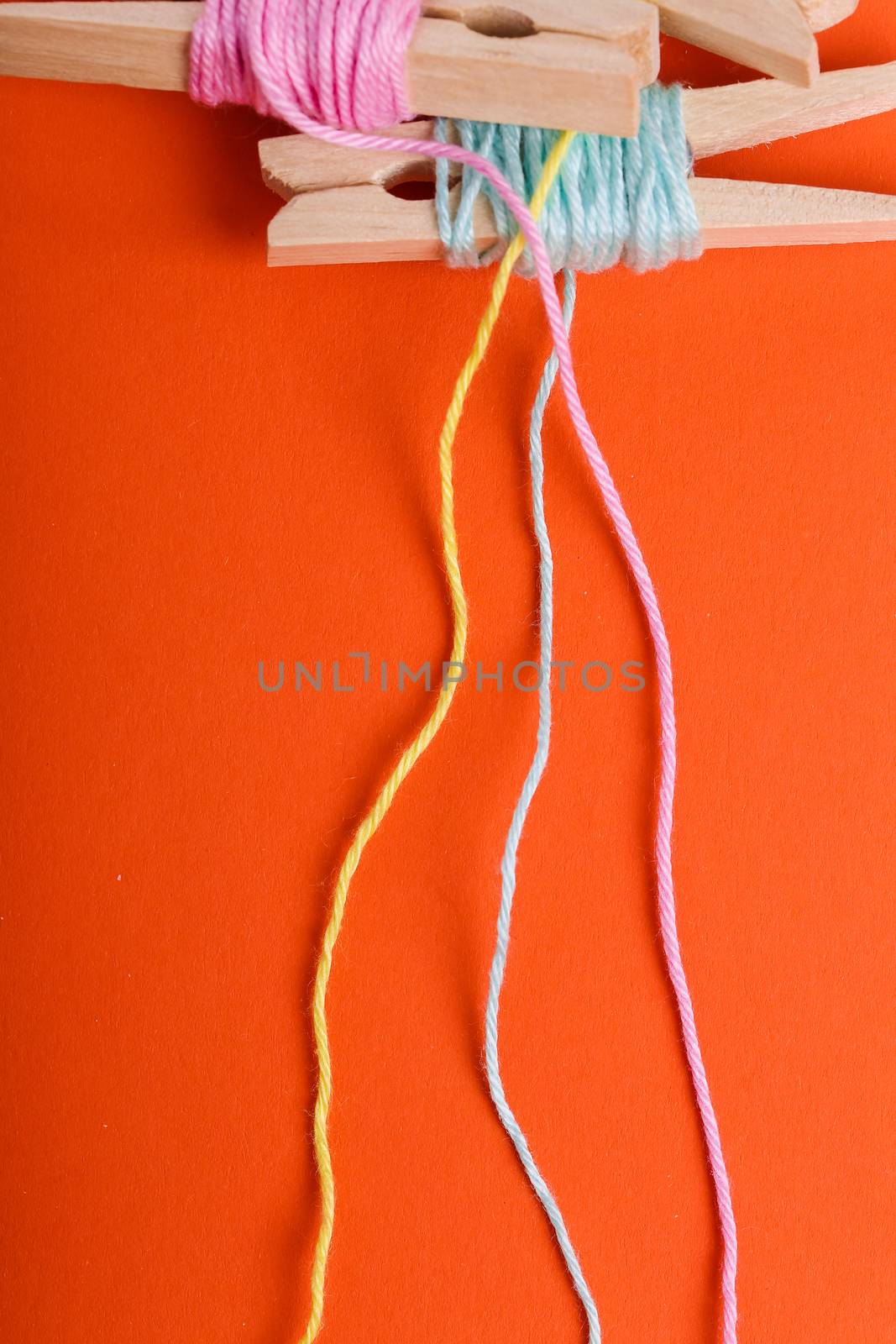 Threads on a orange background