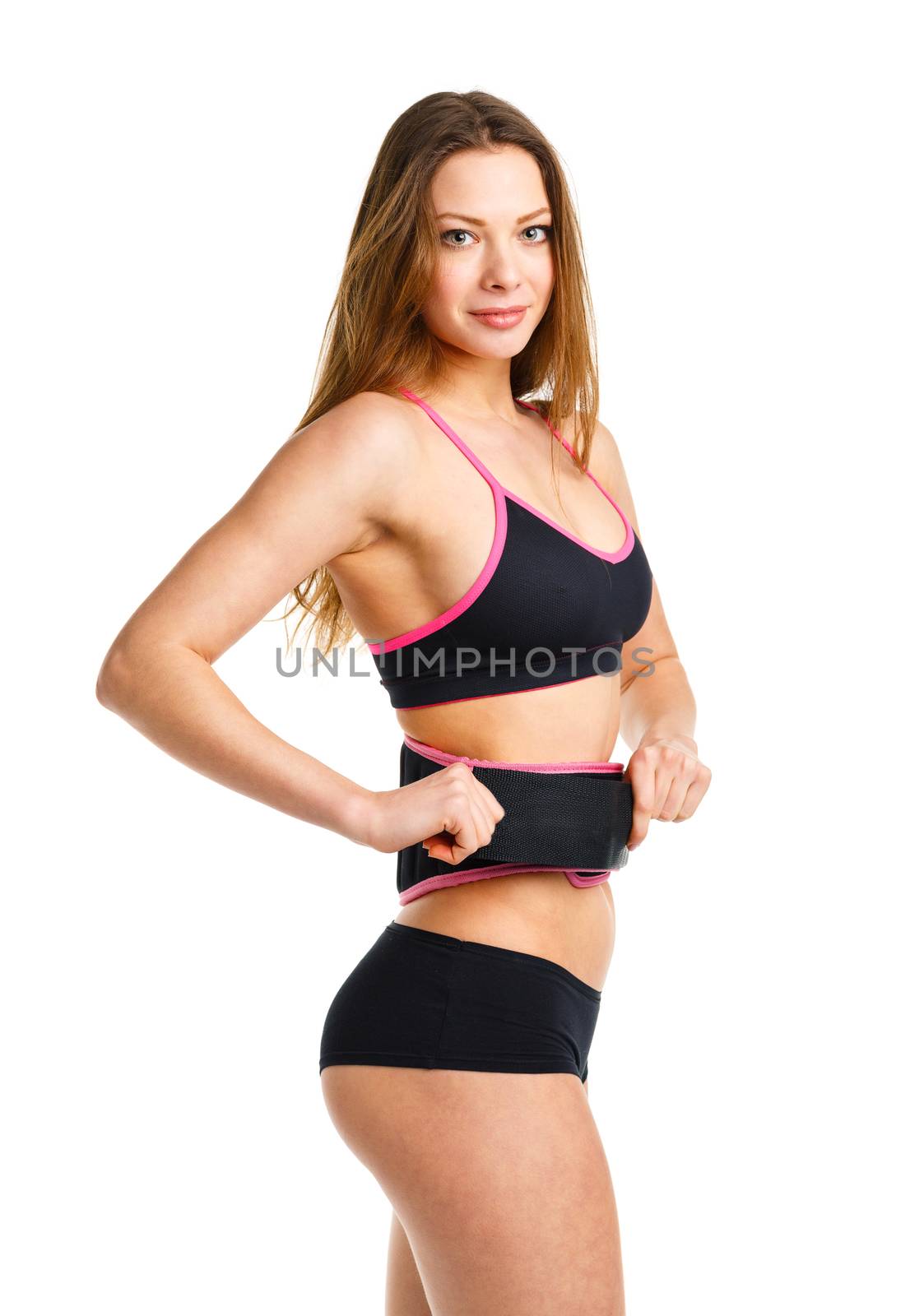 Happy young athletic woman doing sport exercise