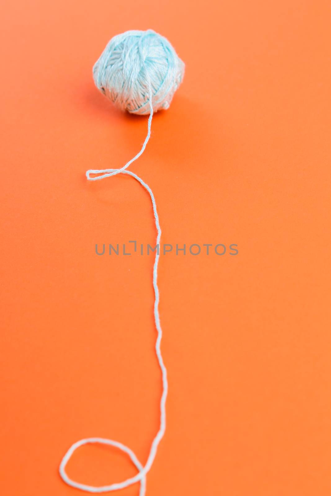 Threads on a orange background