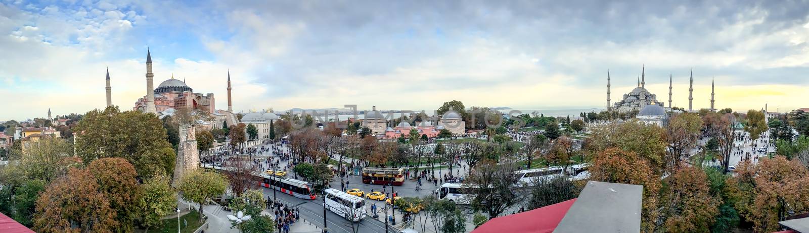 ISTANBUL - SEPTEMBER 21, 2014: Tourists enjoy city life in Sultanahmet Park. Istanbul attracts more than 10 million every year.