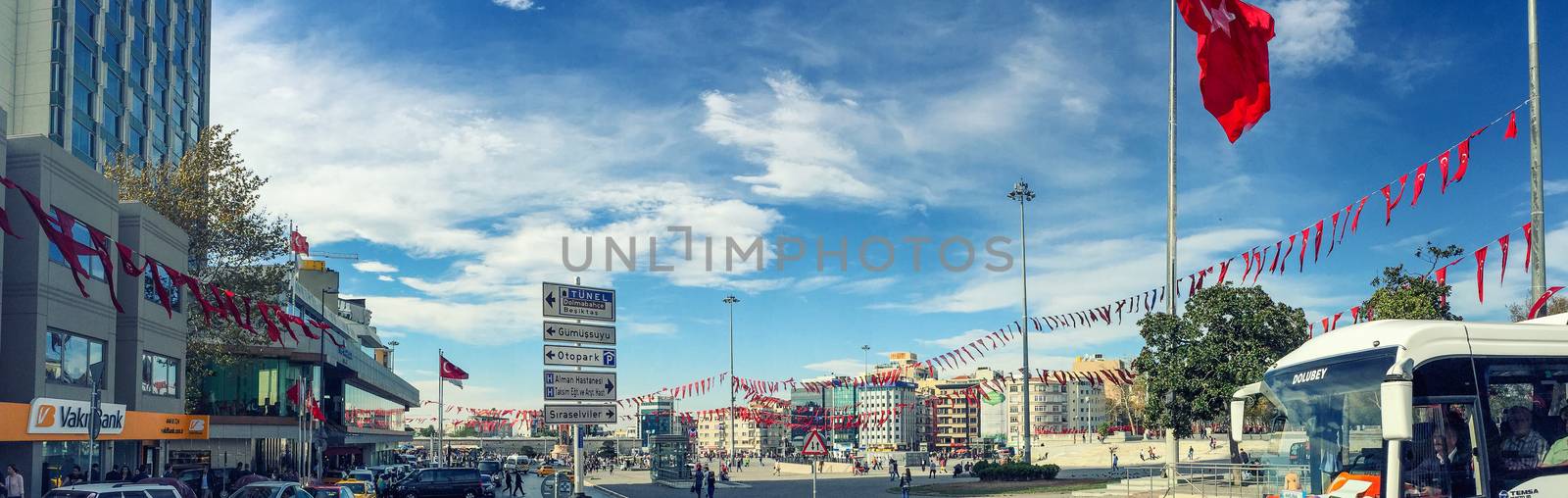 ISTANBUL, TURKEY - OCTOBER 23, 2014: People walking at Taksim Square in Istanbul. Taksim Square is a leisure district famous for its restaurants, shops, and hotels.