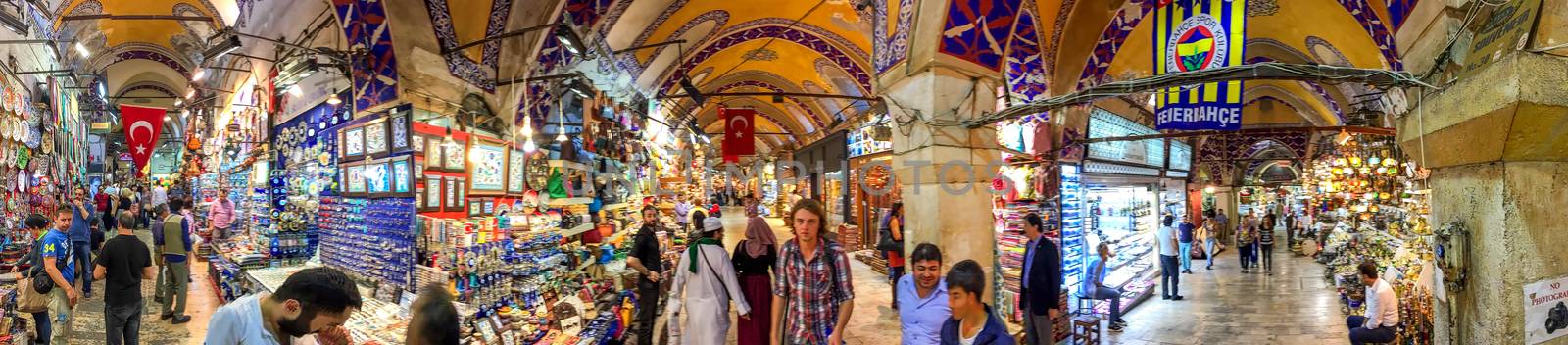 ISTANBUL - SEPTEMBER 22, 2014: Blurred movements of tourists and locals in Grand Bazaar. It's one of the largest and oldest covered markets in the world, with 61 covered streets and over 3,000 shops