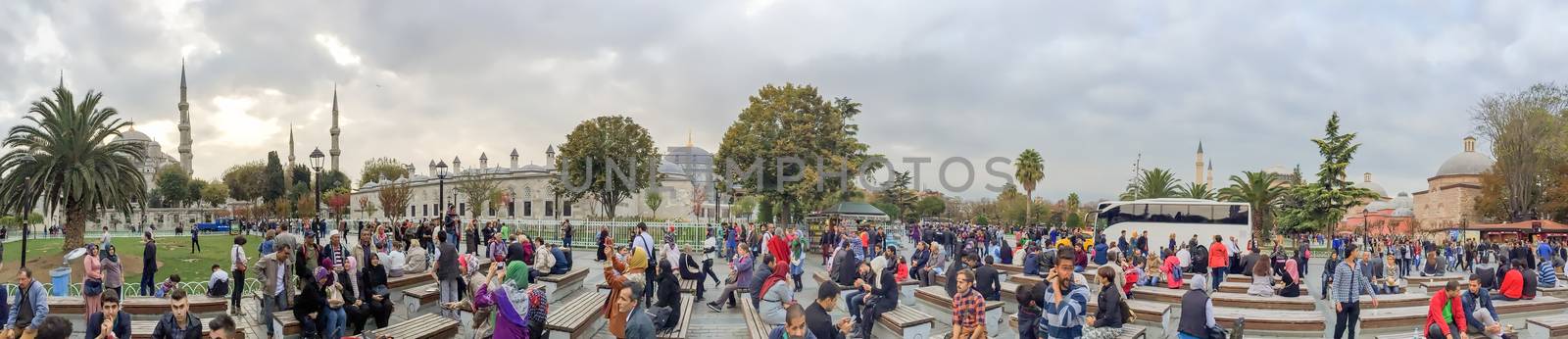 ISTANBUL - SEPTEMBER 21, 2014: Tourists enjoy city life in Sultanahmet Park. Istanbul attracts more than 10 million every year.