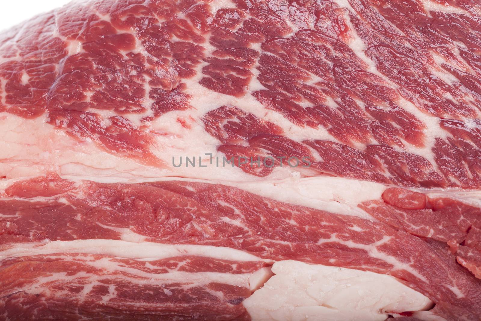 Fresh Slice of Protein Rich Raw Beef Meat on Top of the Table on White Background