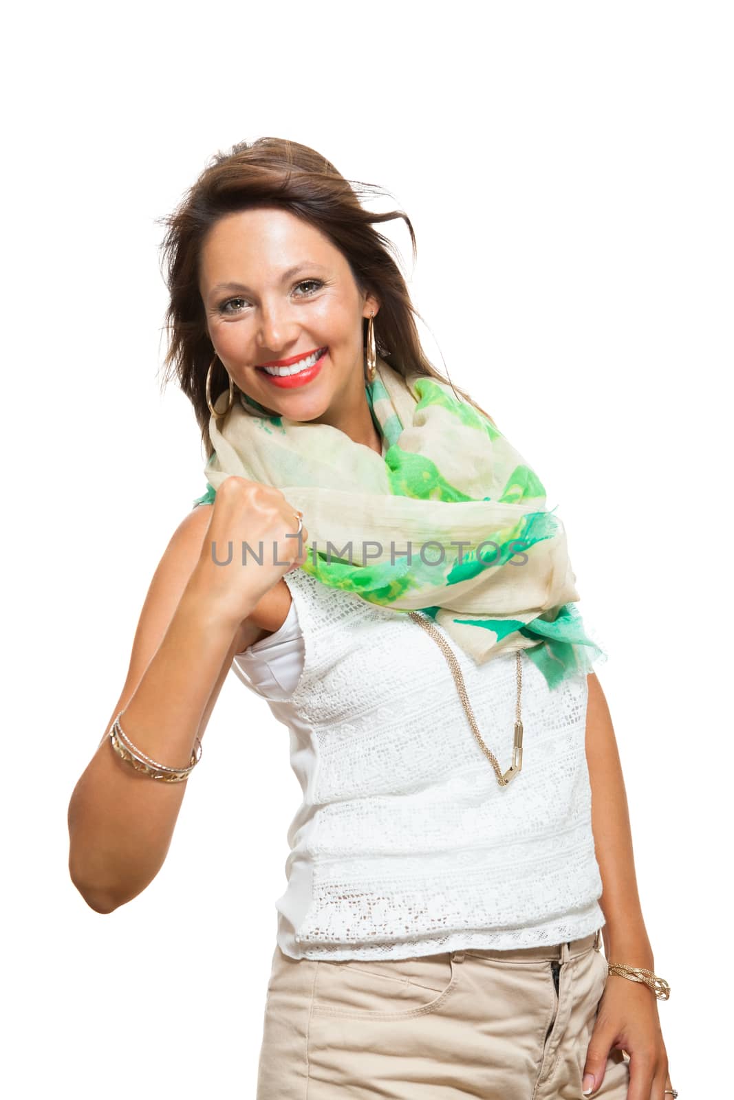 Close up Pretty Young Woman in Trendy Outfit, Showing her Arm Muscles While Holding Back Hair and Looking at the Camera. Isolated on White Background.