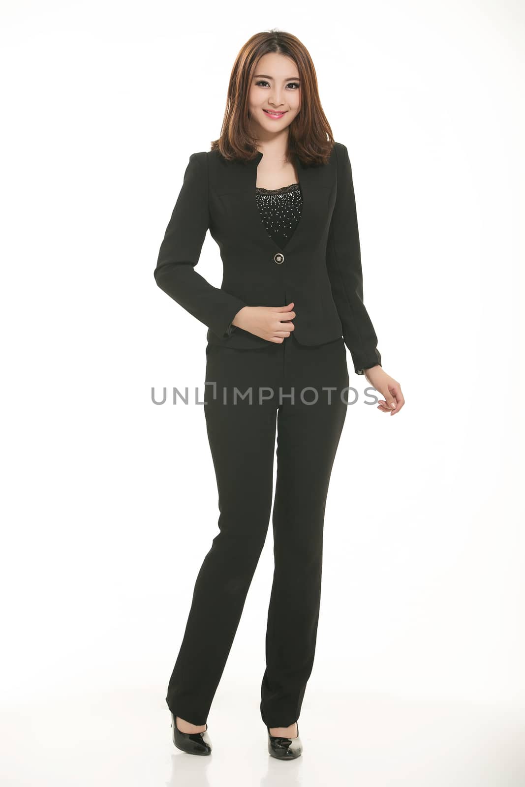 Young Asian women wearing a suit in front of a white background