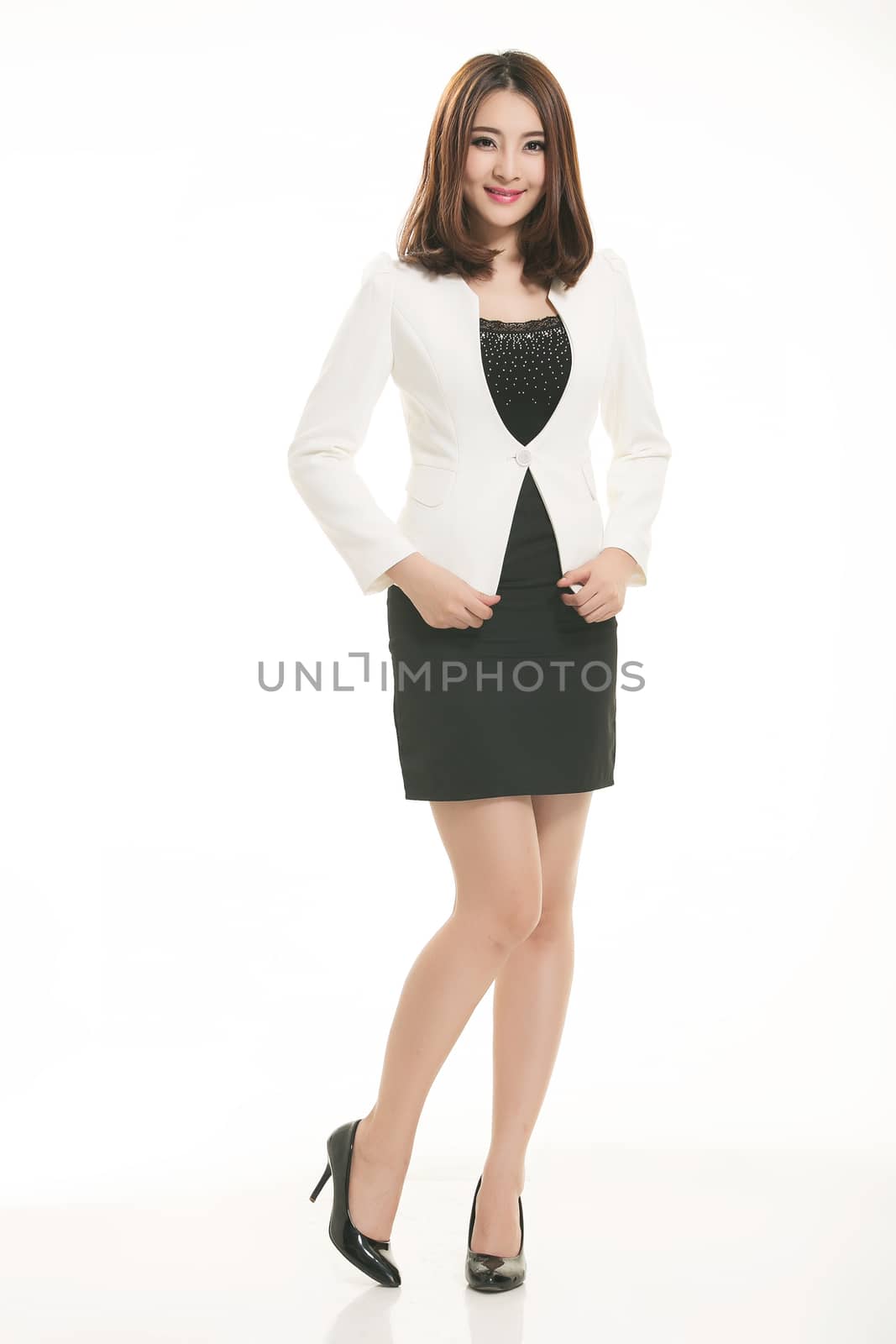 Young Asian women wearing a suit in front of a white background