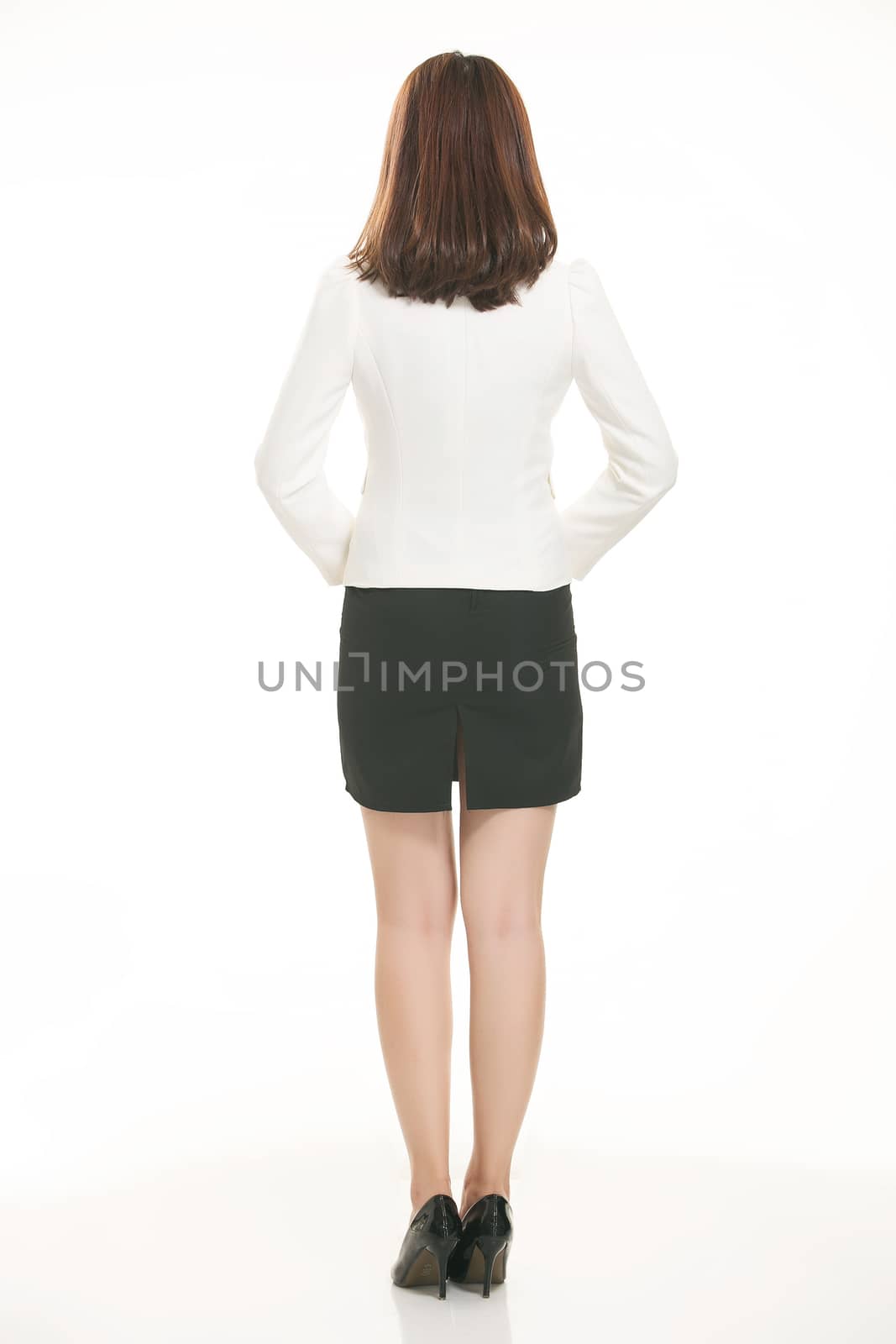 Young Asian women wearing a suit in front of a white background
