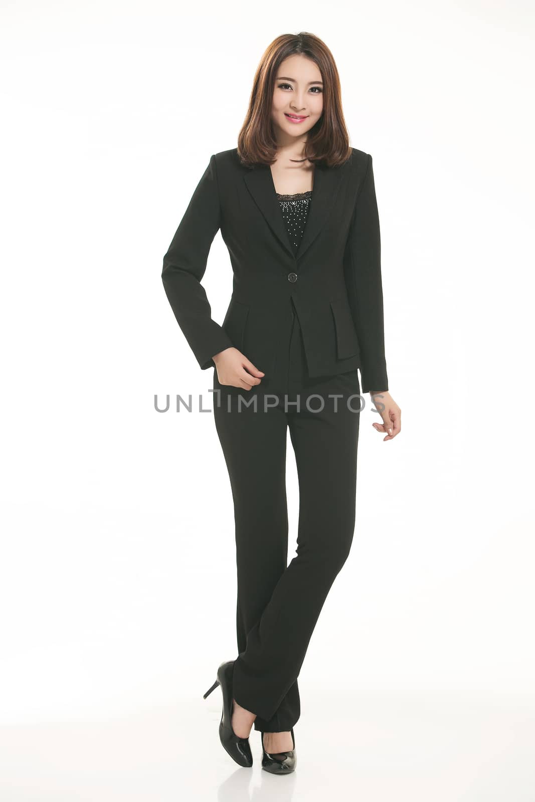 Young Asian women wearing a suit in front of a white background by quweichang