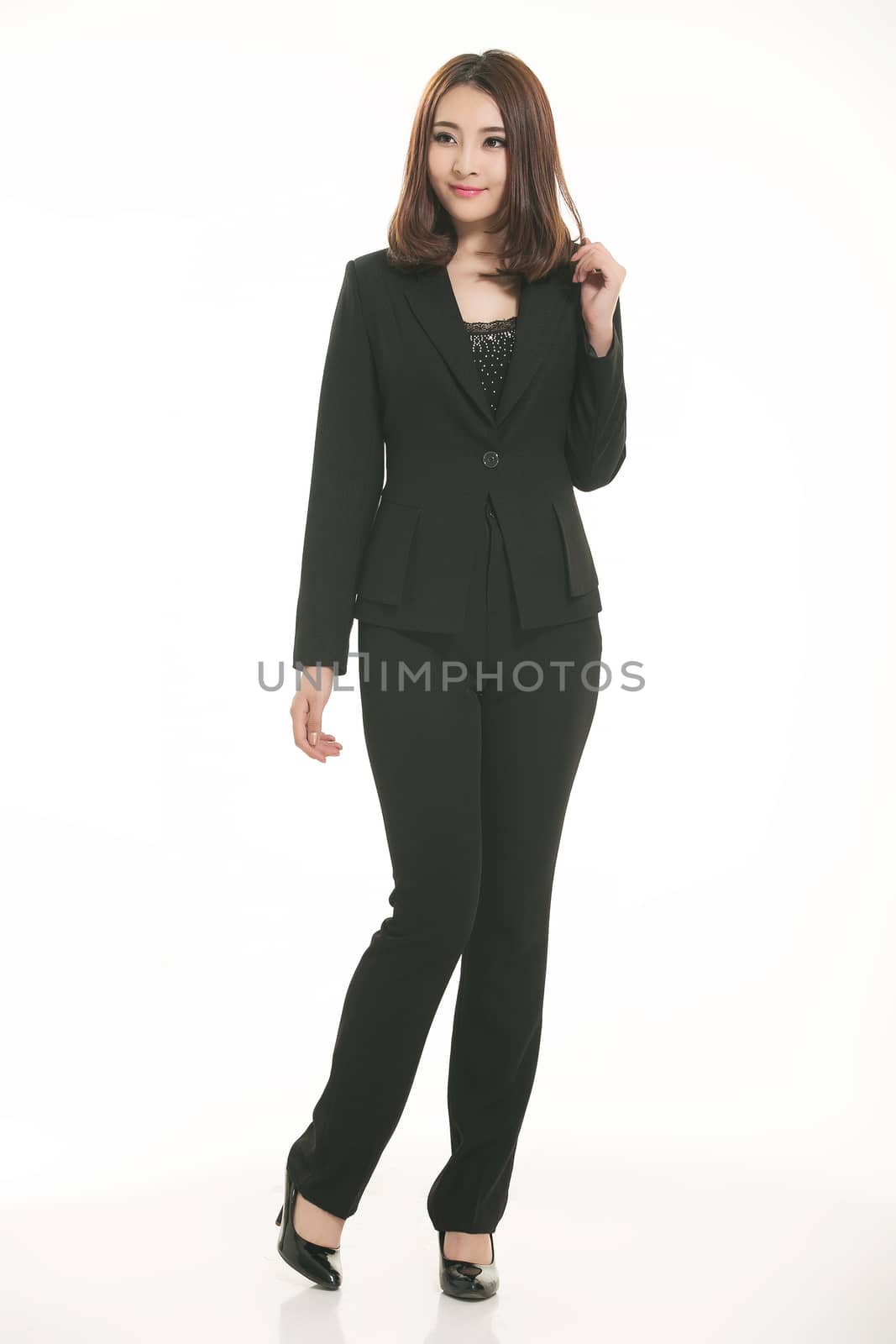 Young Asian women wearing a suit in front of a white background