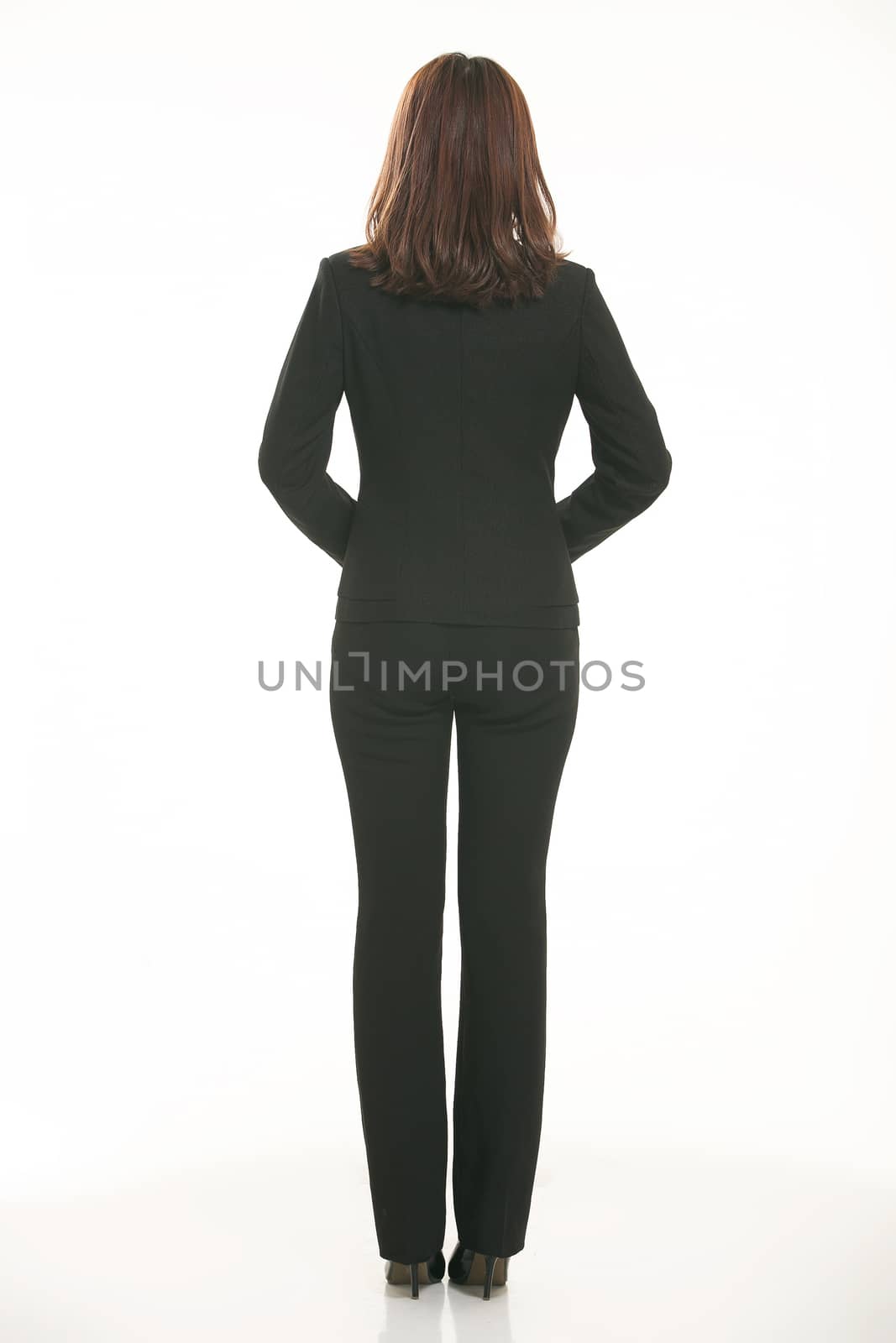 Young Asian women wearing a suit in front of a white background by quweichang