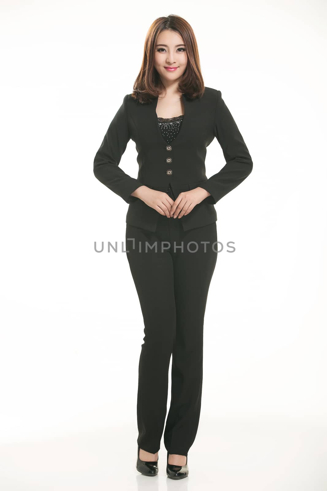 Young Asian women wearing a suit in front of a white background