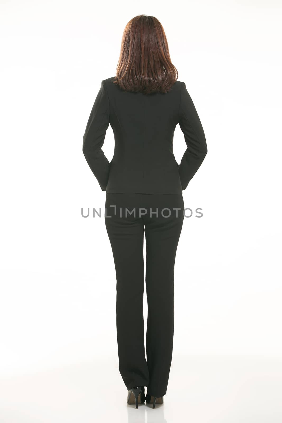 Young Asian women wearing a suit in front of a white background by quweichang