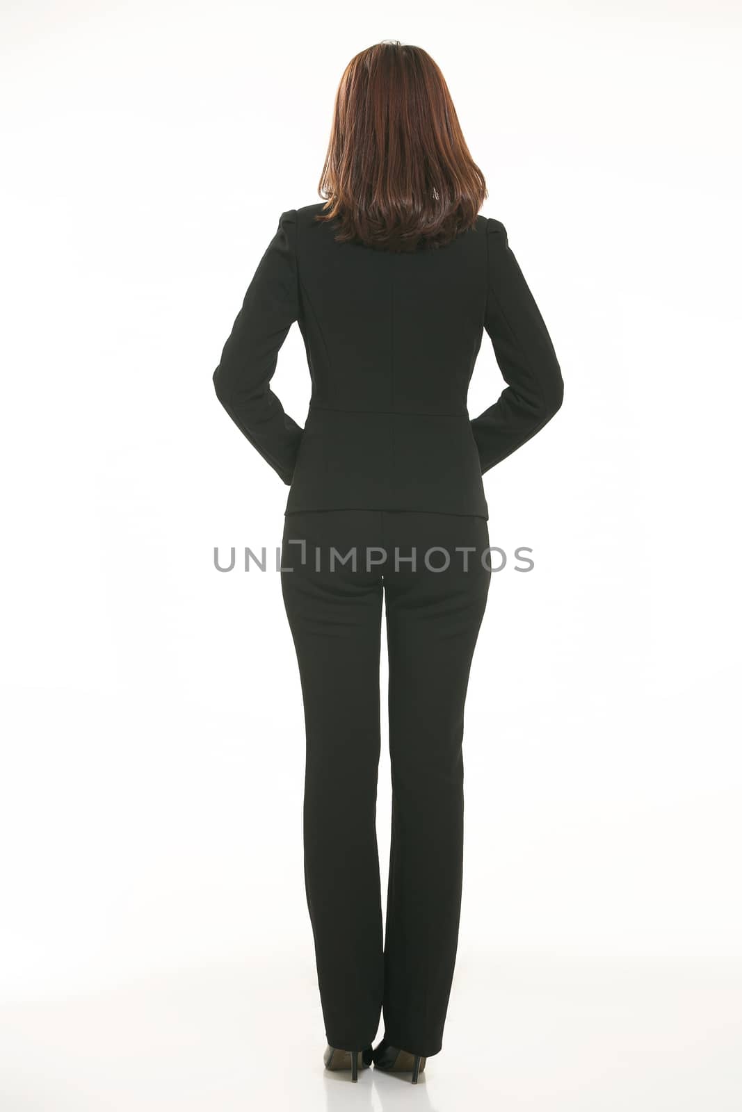 Young Asian women wearing a suit in front of a white background