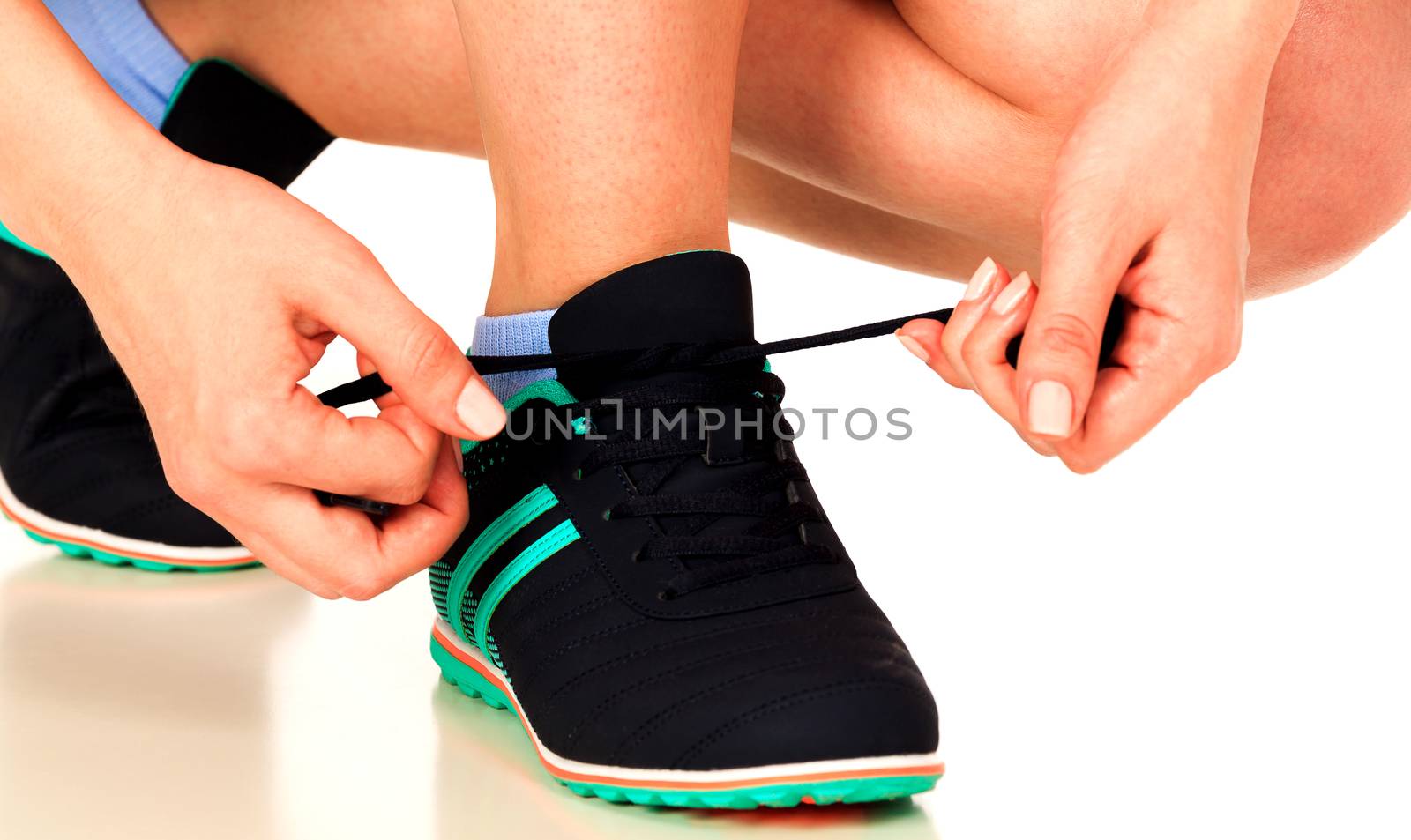 Running shoes being tied by woman, white background, isolated, copyspace