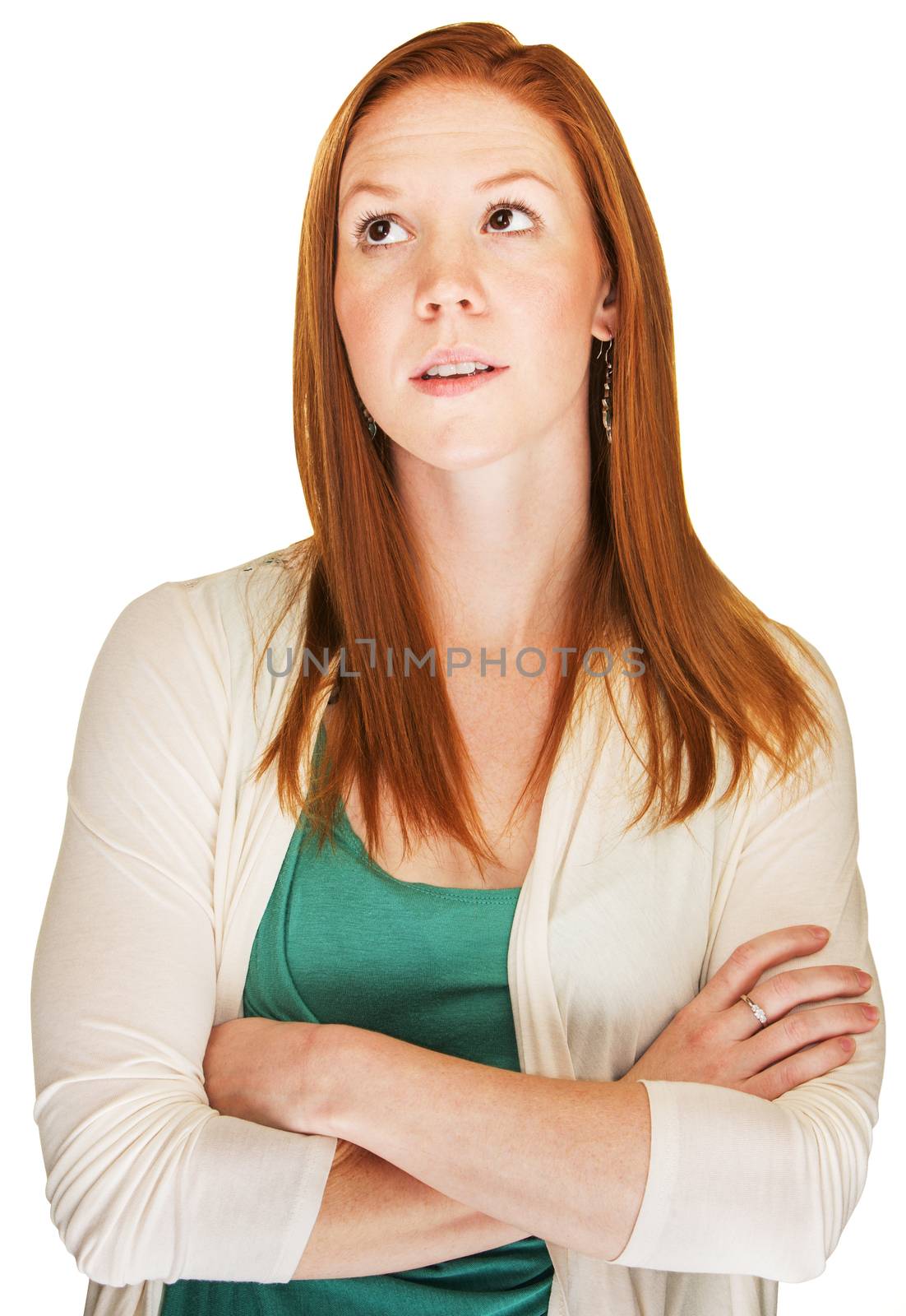 Snobbish red haired young woman with arms folded