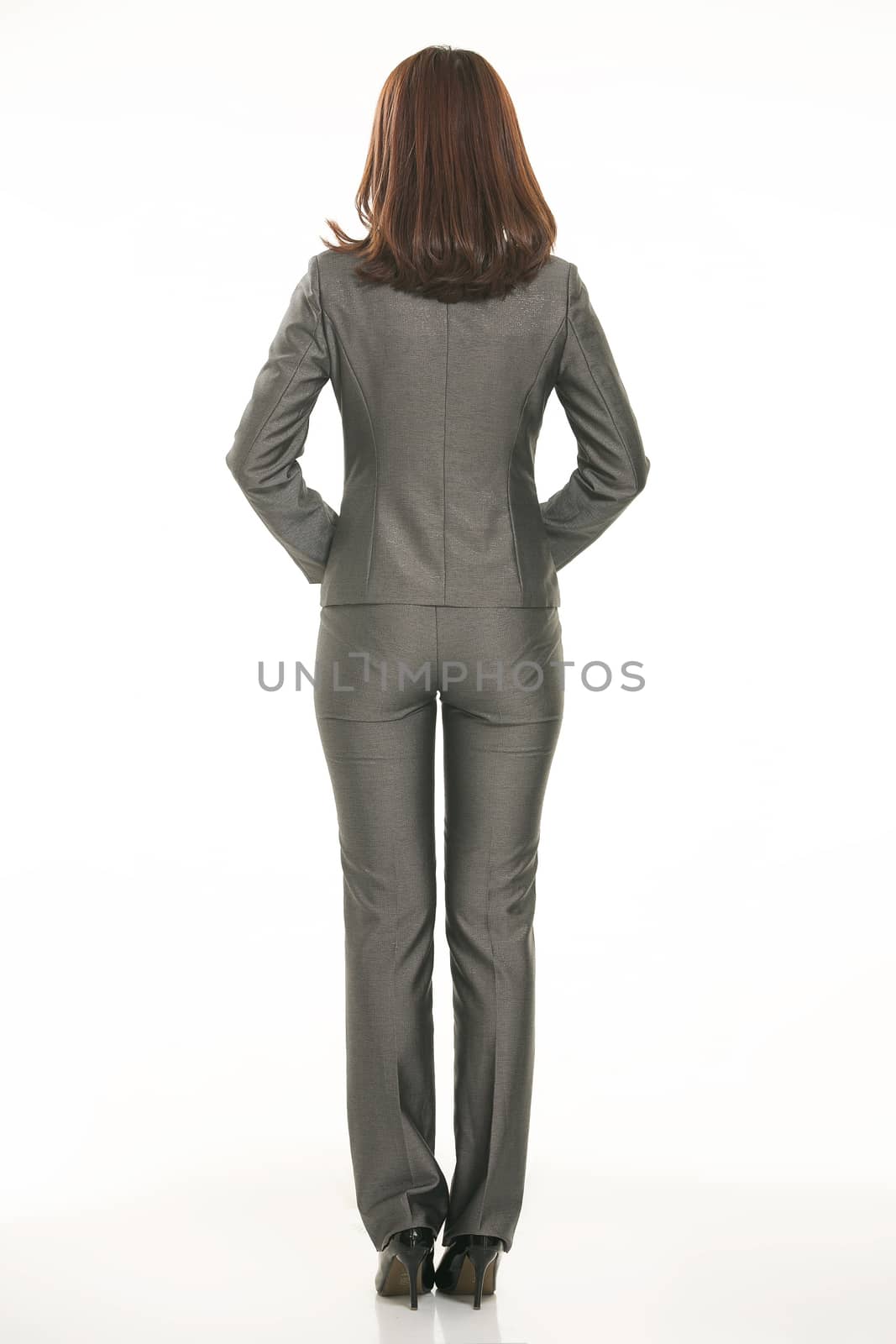 Young Asian women wearing a suit in front of a white background