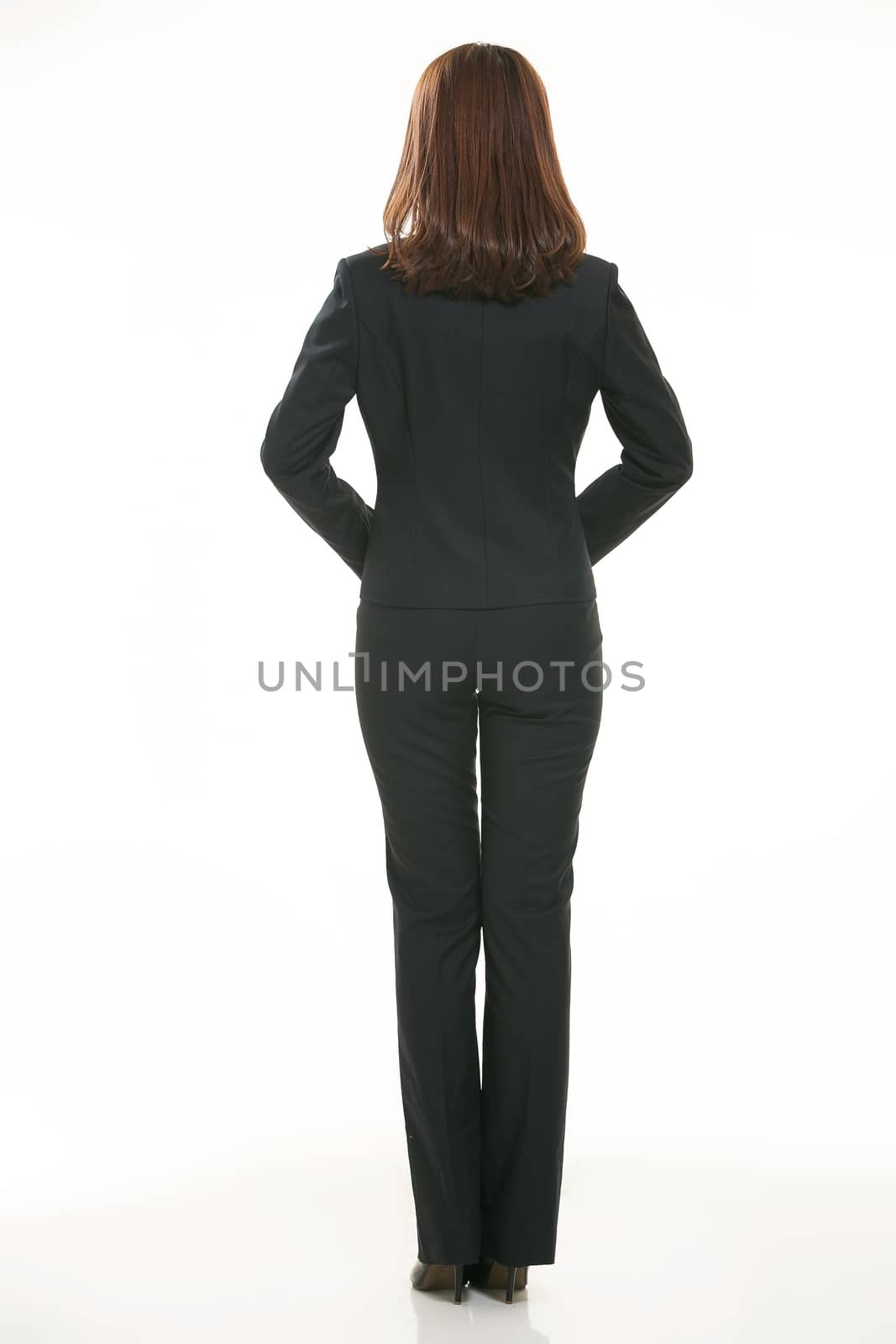 Young Asian women wearing a suit in front of a white background