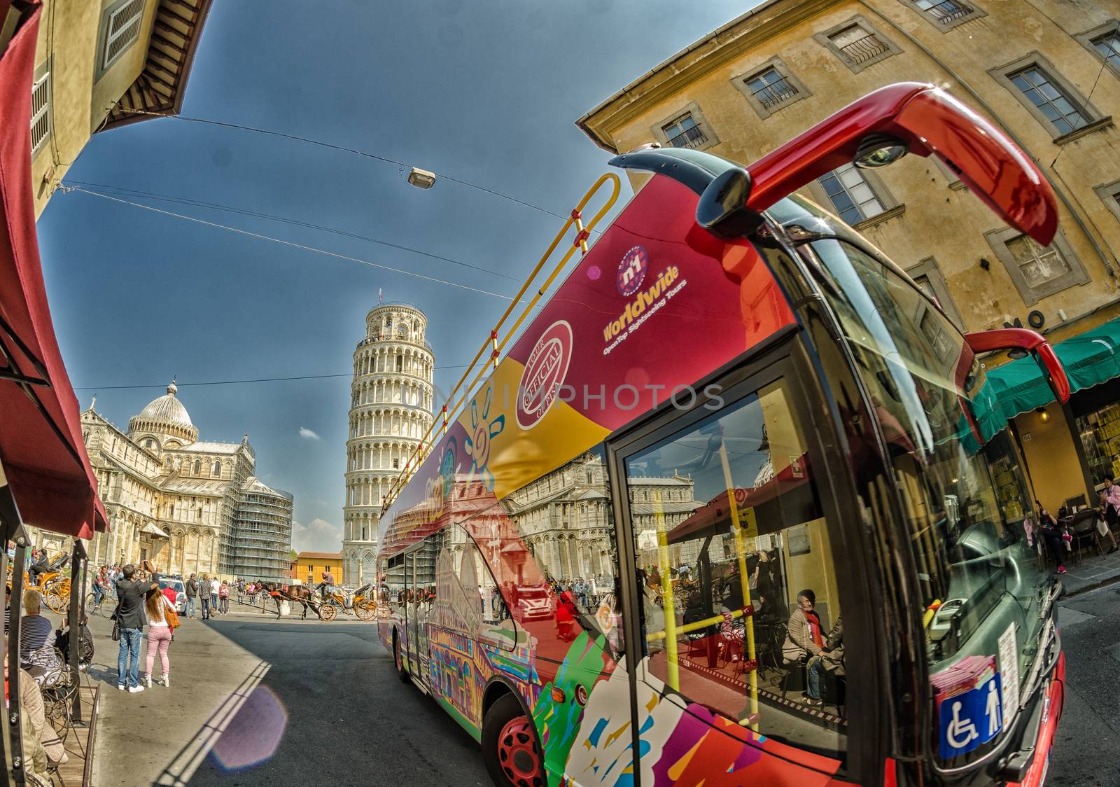 PISA, ITALY - MAY 12, 2014: Sightseeing bus in Square of Miracle by jovannig