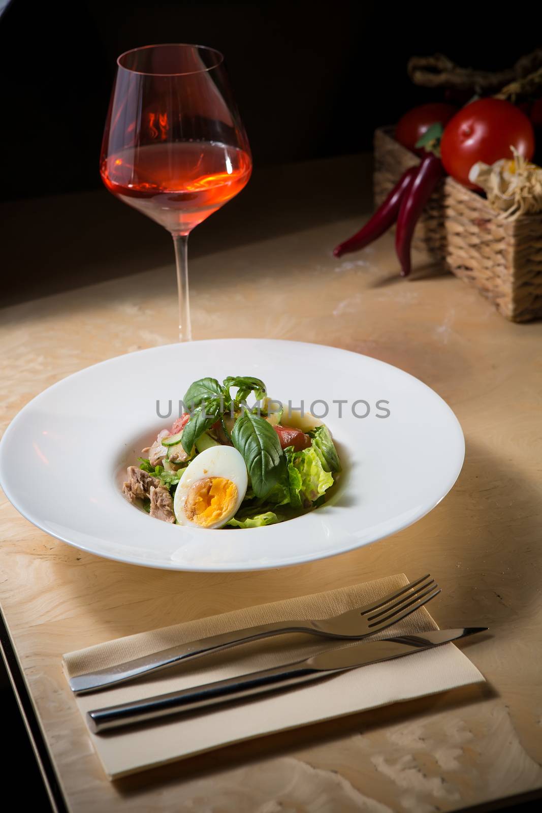 plate of spring mix salad with strawberry, eggs and tuna by sarymsakov