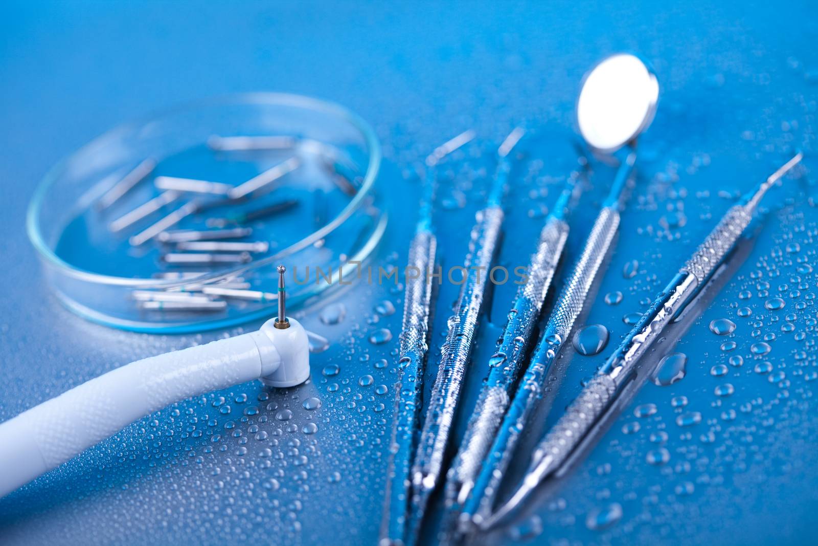 Dentist equipment on blue background