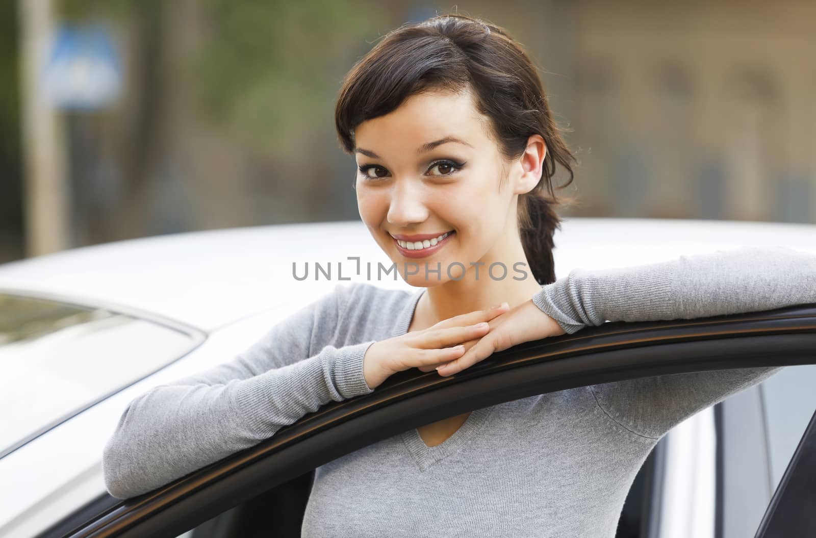 Pretty girl and white car