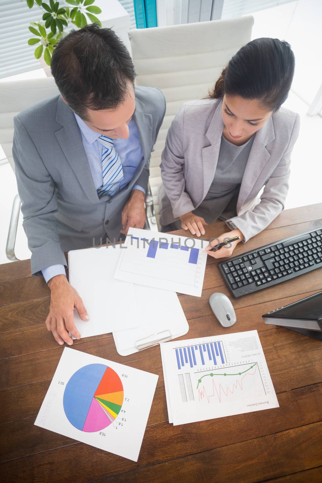 Businesswoman working with team mate in an office