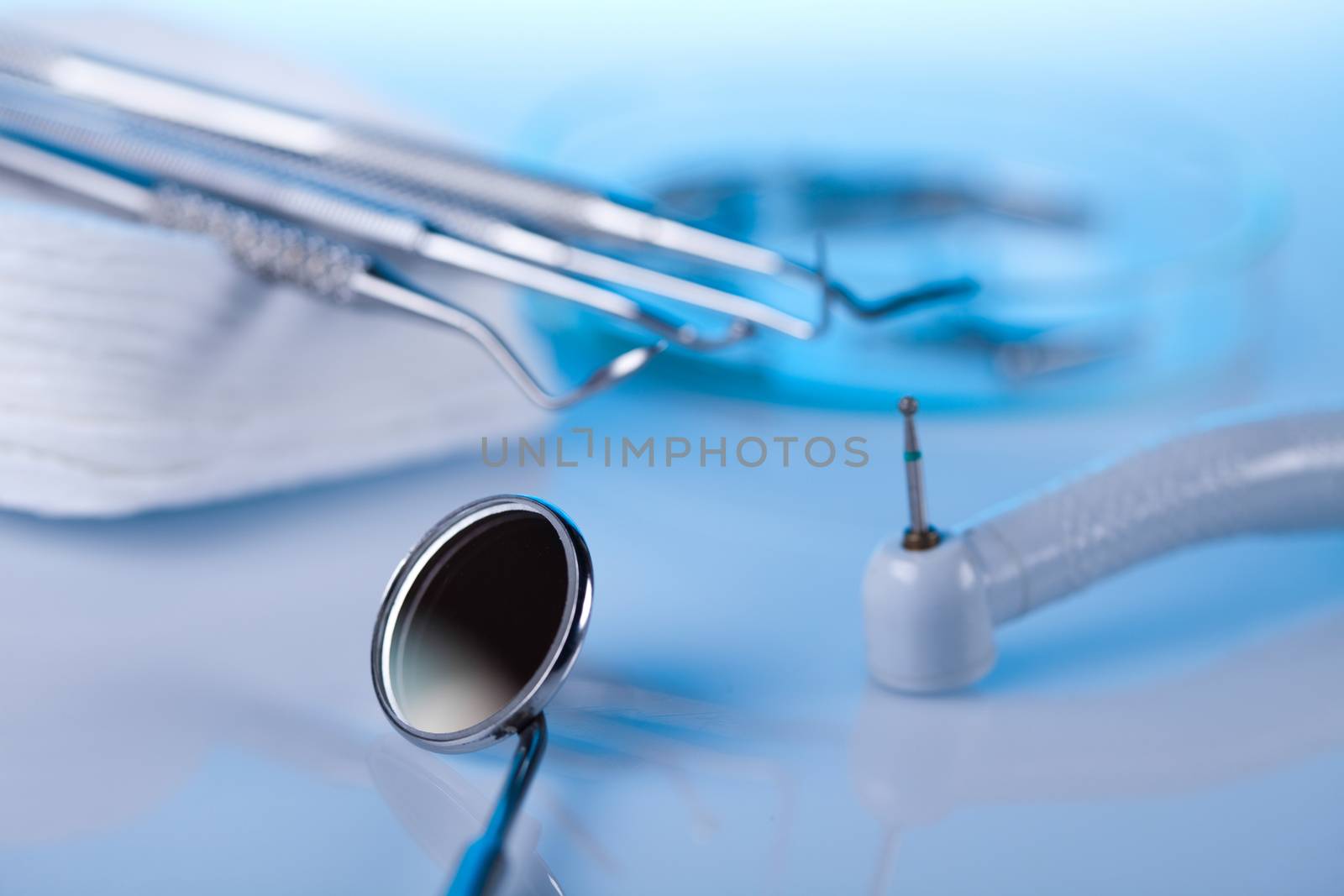 Dental instruments and tools in a dentists office by JanPietruszka