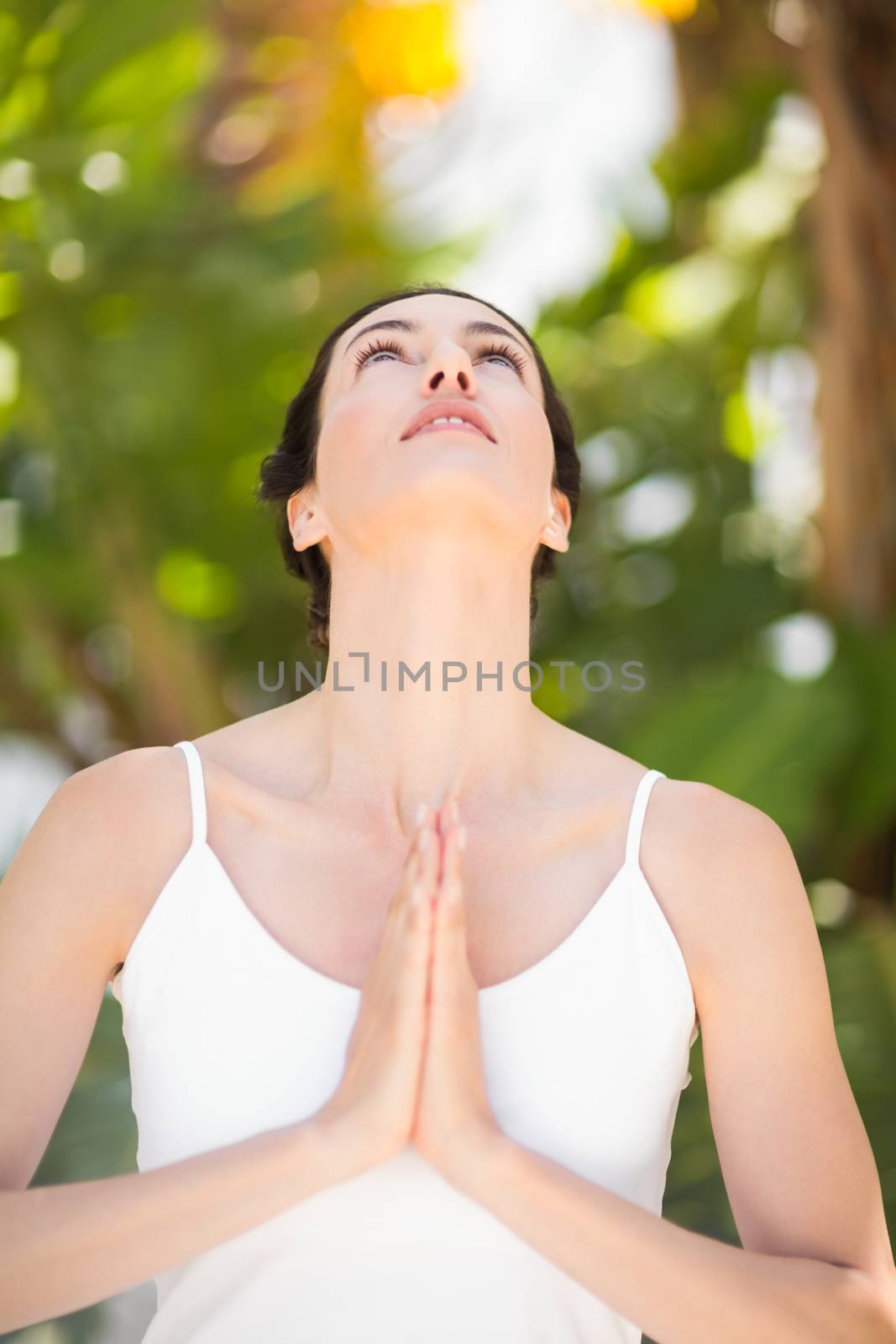 Portrait of a woman in a meditation position by Wavebreakmedia