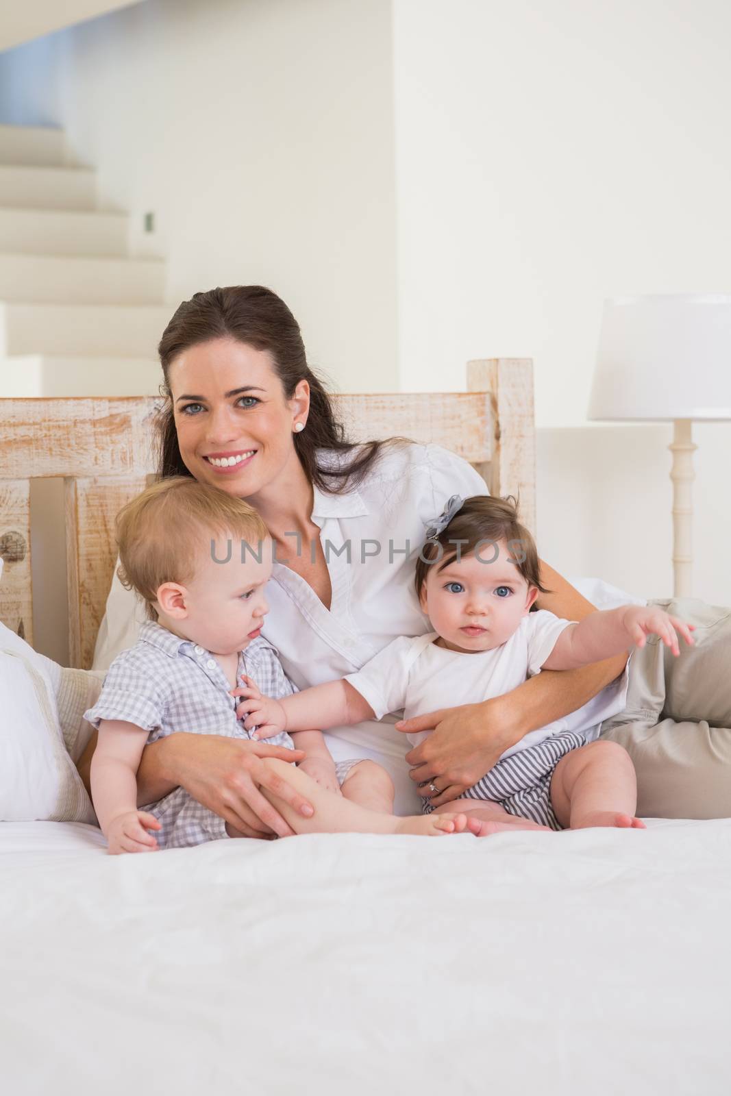Happy mother with cute babies boy and girl by Wavebreakmedia