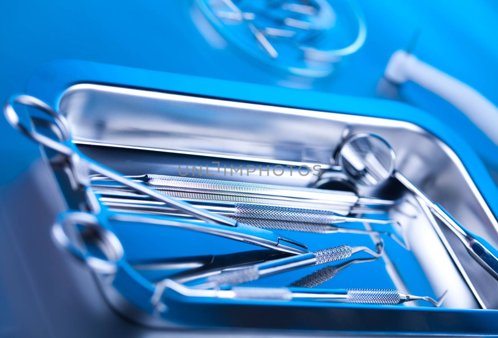 Dentist equipment on blue background