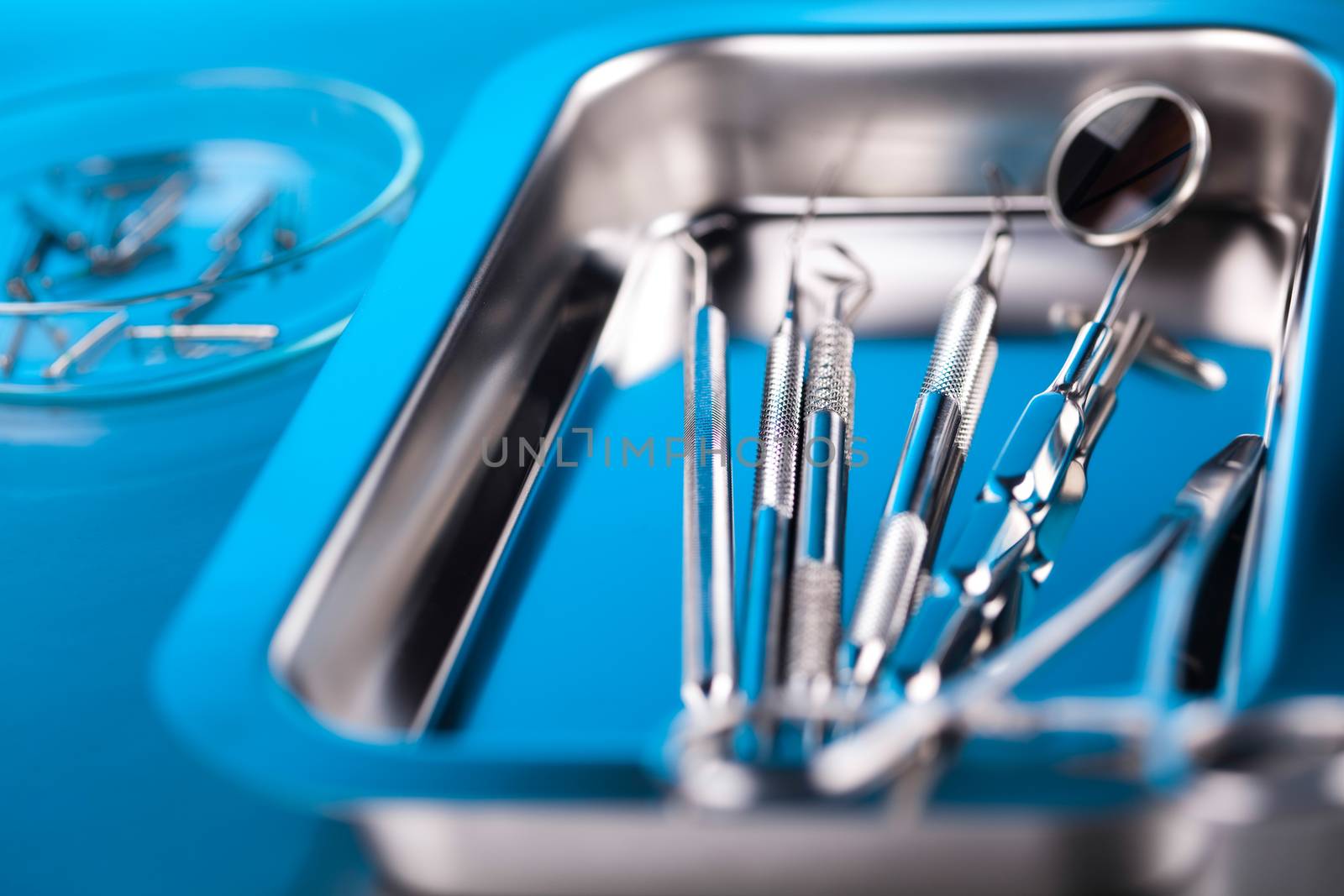 Dentist equipment on blue background