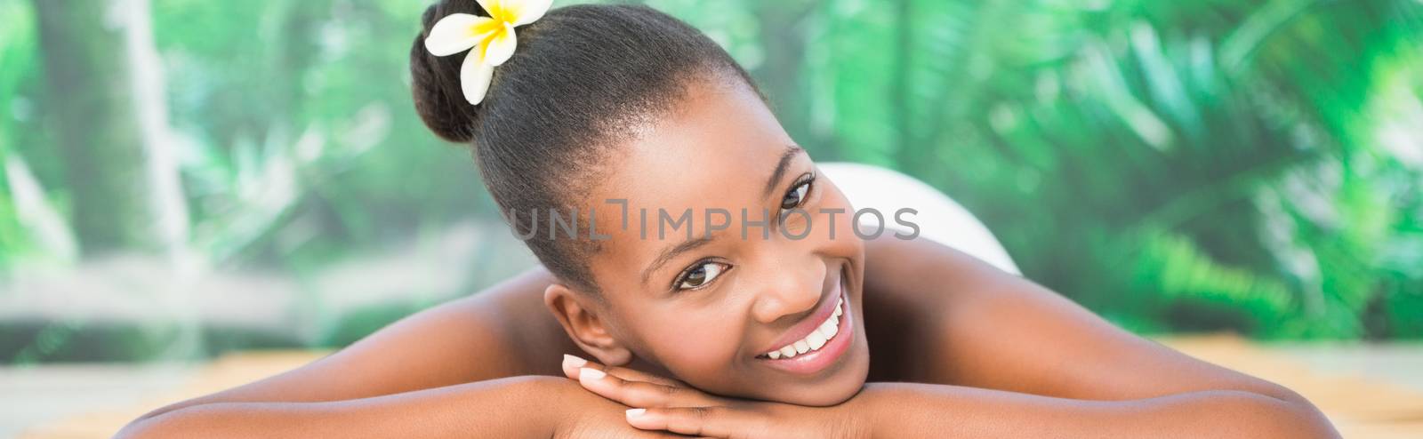 Pretty woman lying on massage table at the health spa