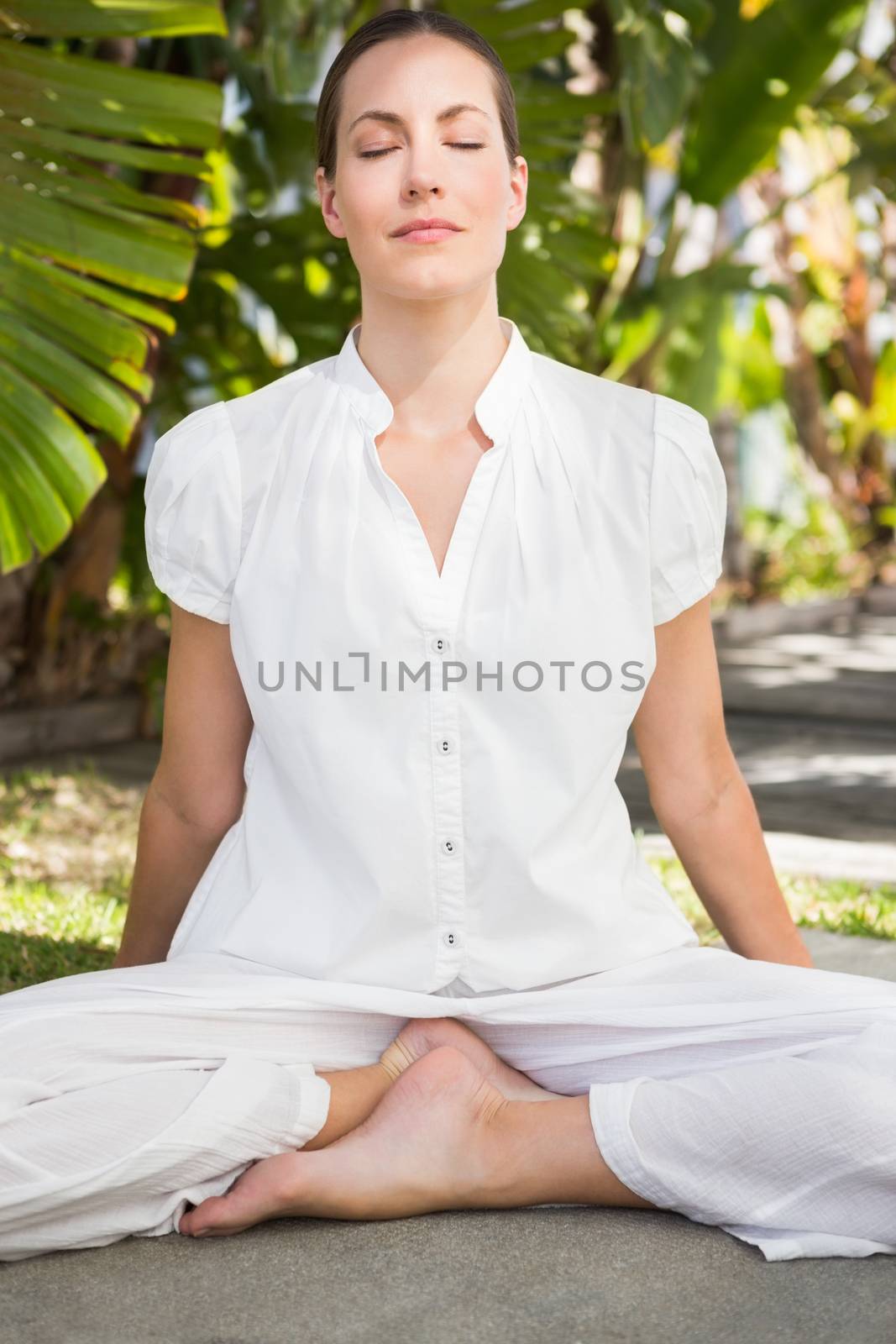 A young woman doing yoga over white backgroung