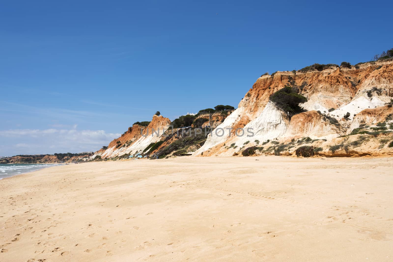 Cliffs at Praia da Falesia near villamoura in portugal area algarve with big staiors to the beach