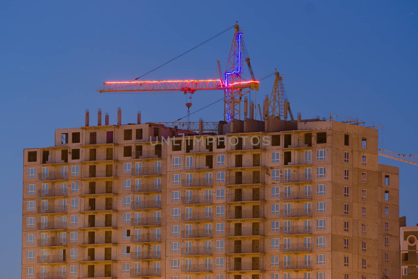 Construction of multi-storey building with a crane