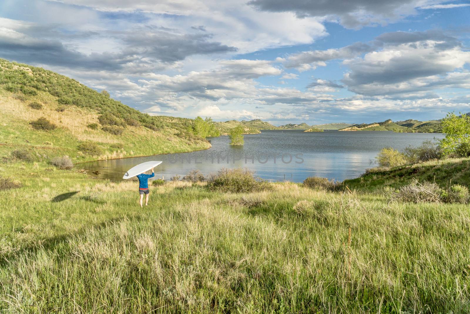 lake landscape with SUP paddleboard by PixelsAway