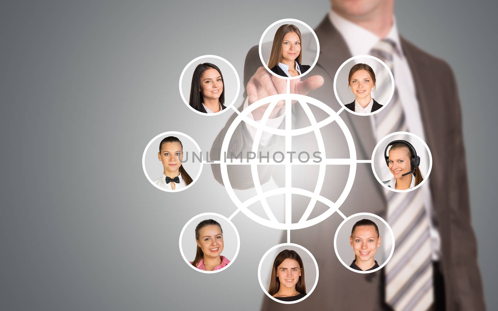 Businessman pressing on holographic screen with women faces