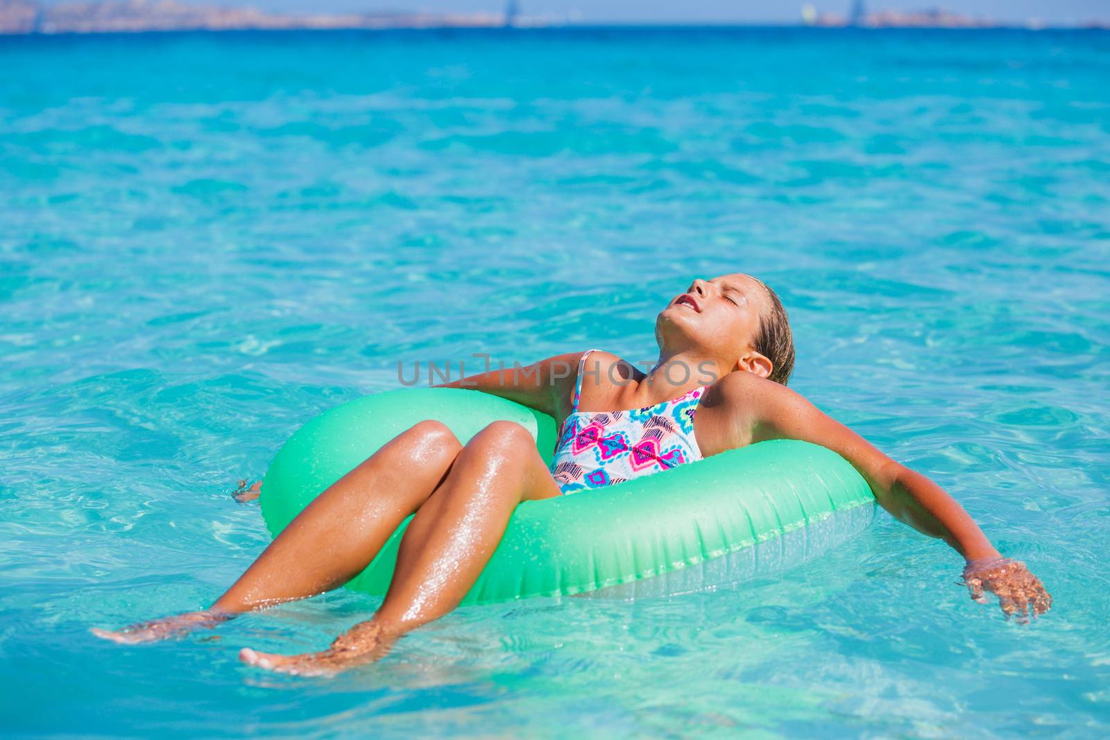 Girl relaxing in the sea by maxoliki
