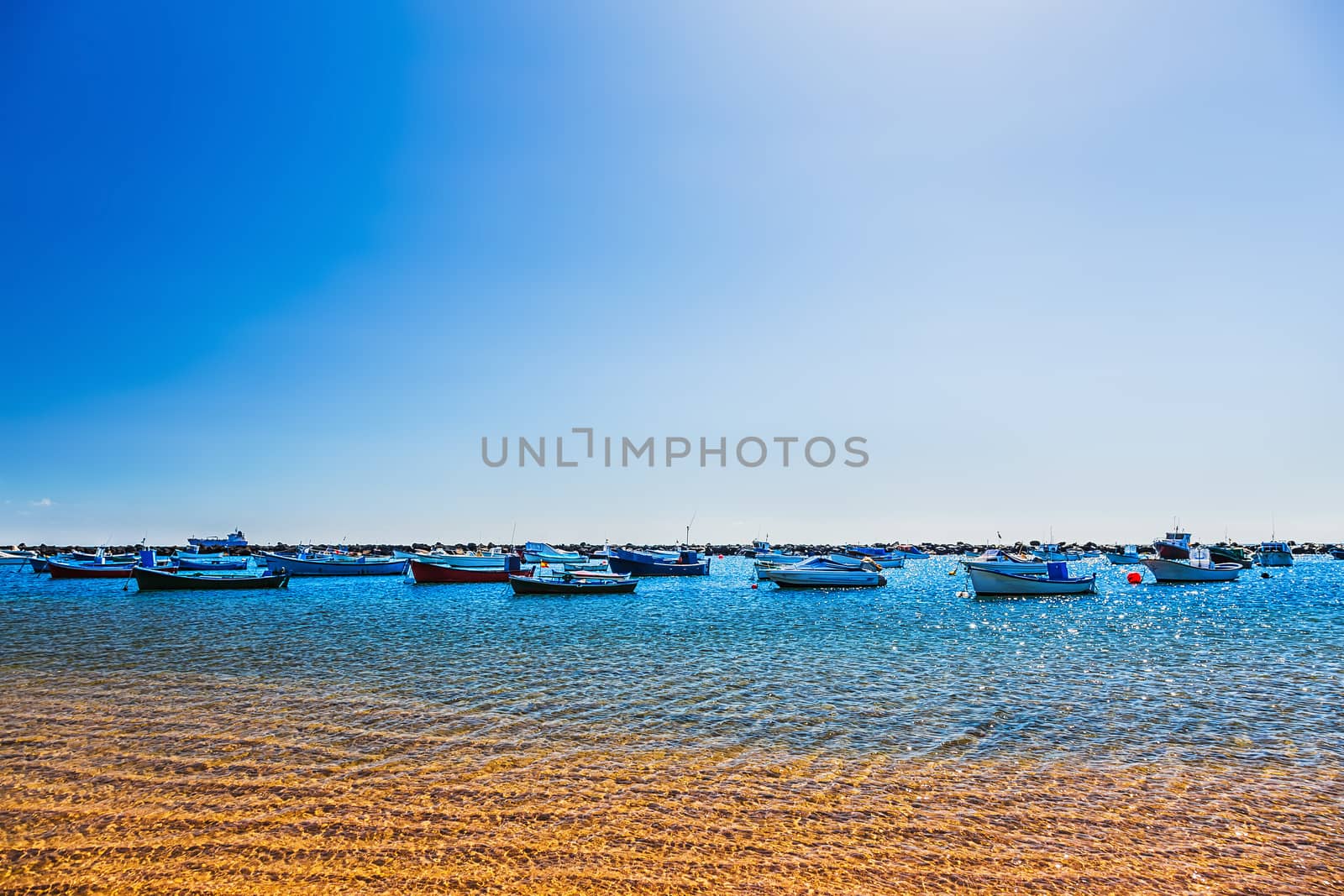 Boats on the water with waves in bay or harbor