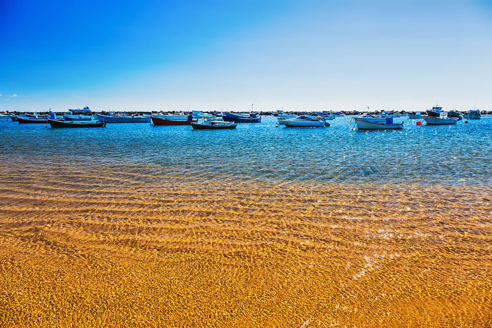 Boats on the water with waves in bay or port