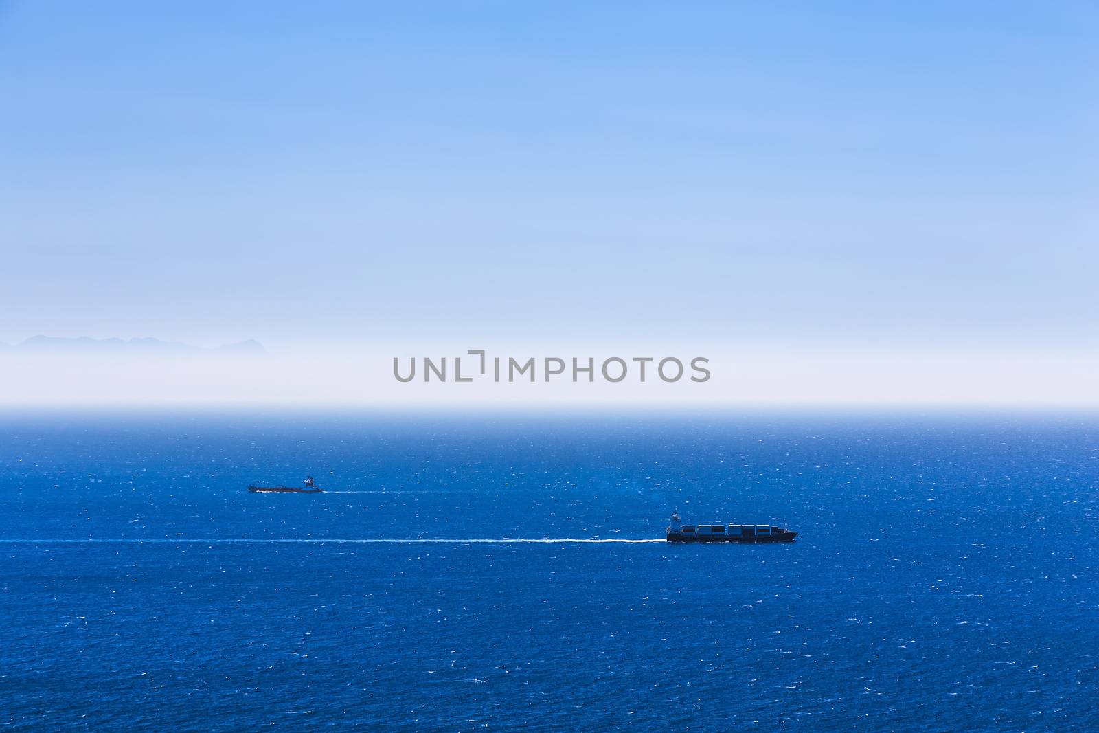 Cargo ships with containers in the open Atlantic ocean