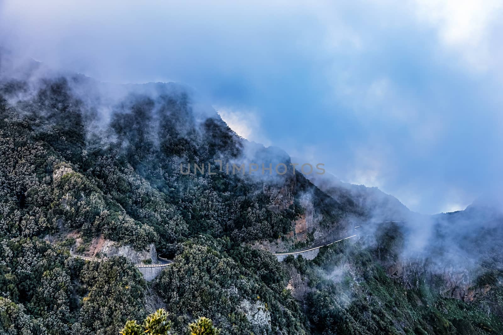 Landscape with clouds over mountain with winding road in Tenerife Canary island, Spain