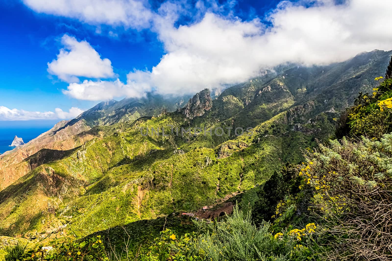 Clouds and mountains or rocks with blue sky background near the Atlantic ocean landscape in Tenerife Canary island, Spain