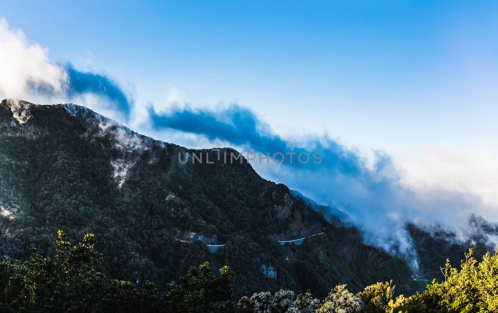 Mountains with clouds on blue sky landscape in Tenerife island, Spain