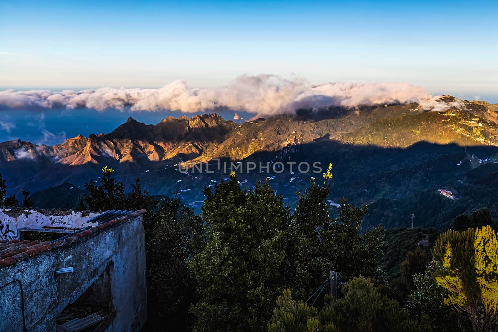Mountain and clouds over peak landscape with sky horizon and old grunge building in Tenerife Canary island, Spain